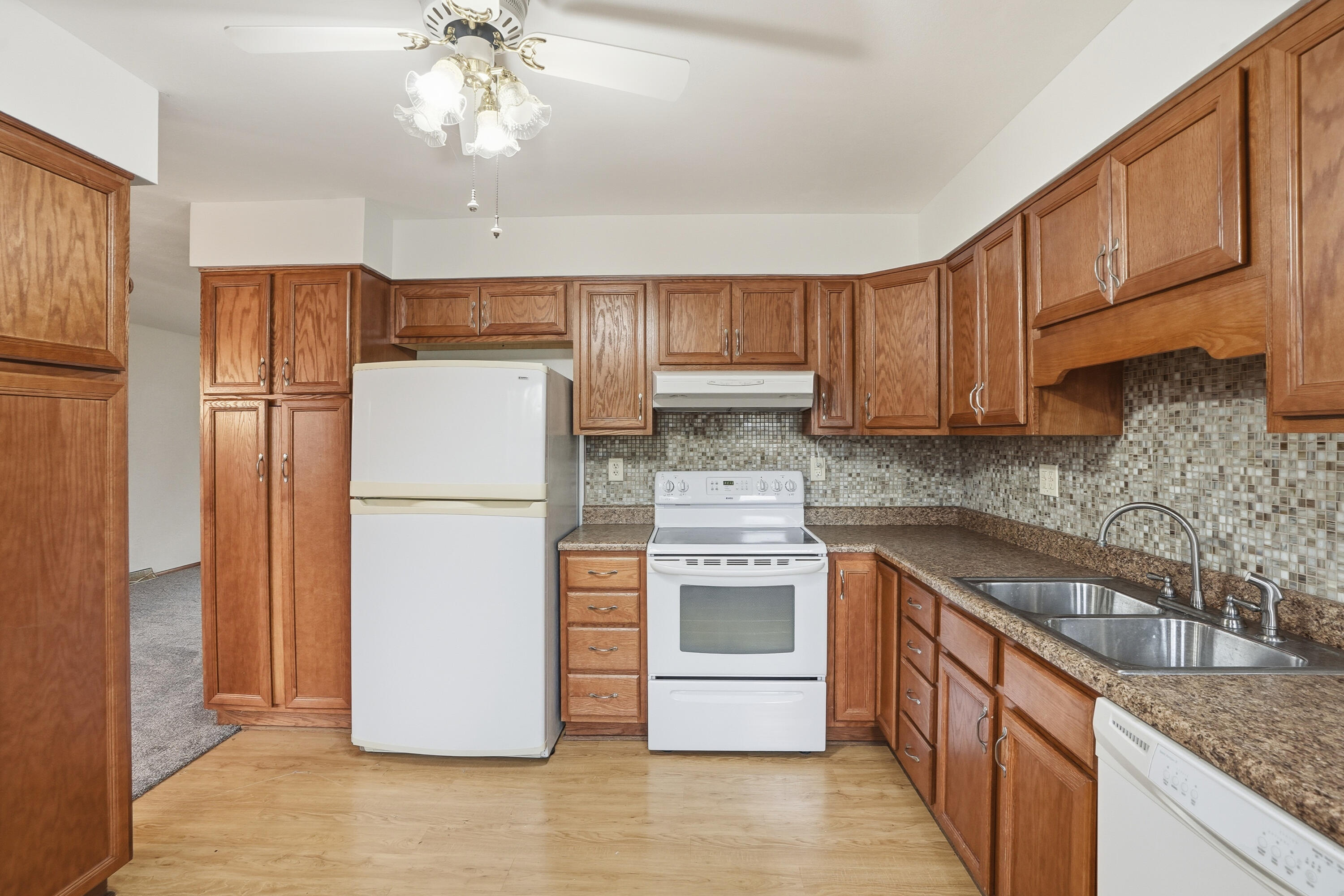 780 Williams Court Crown Point, IN 46307 - Photo 12 of 33 a kitchen with a refrigerator sink and cabinets