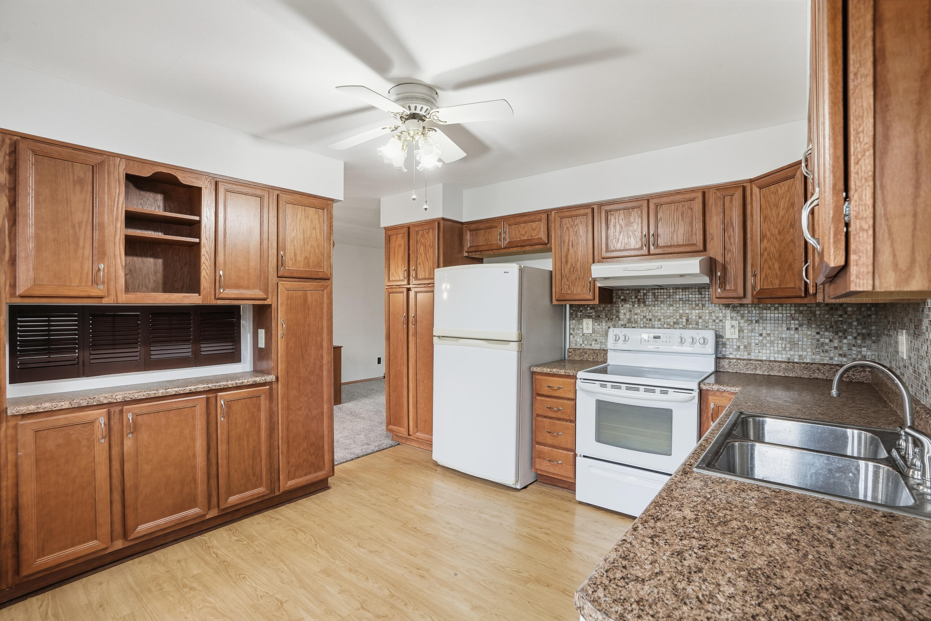 780 Williams Court Crown Point, IN 46307 - Photo 14 of 33 a kitchen with stainless steel appliances granite countertop a refrigerator stove top oven and sink