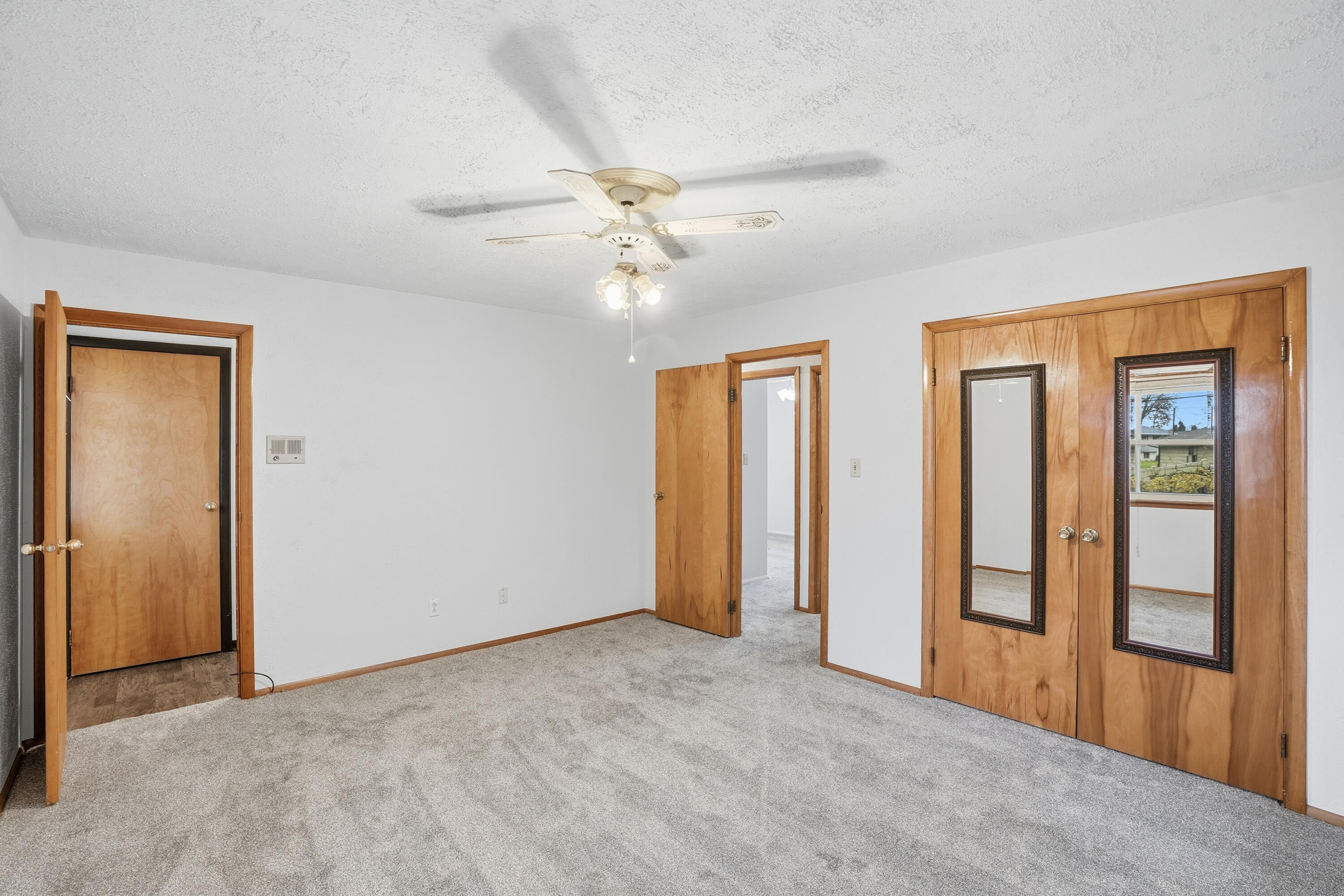 780 Williams Court Crown Point, IN 46307 - Photo 18 of 33 an empty room with chandelier fan and windows