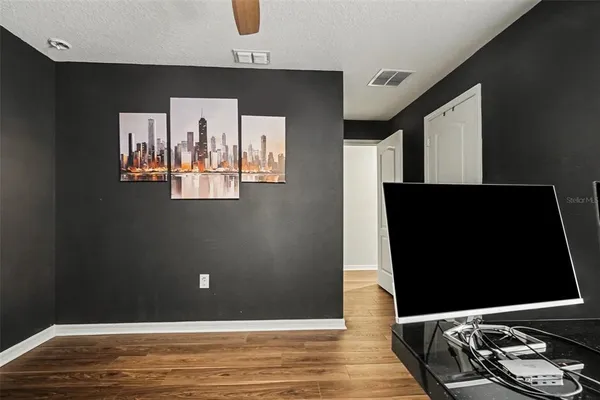 a view of a livingroom with wooden floor