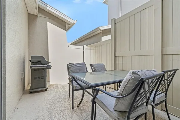 a view of a dining room with furniture and a window