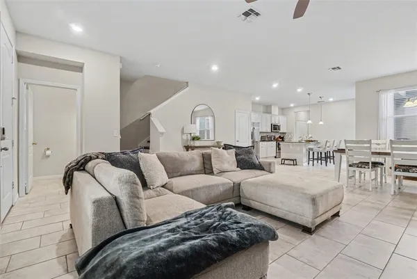 a living room with furniture and a table