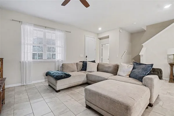 a living room with furniture and a window