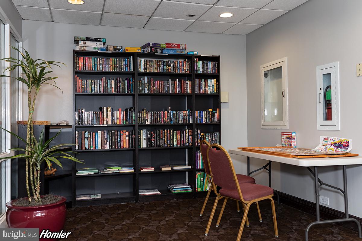 2001 Hamilton Street, Unit 2016 Philadelphia, PA 19130 - Photo 36 of 41 a view of a work space with furniture and bookshelf