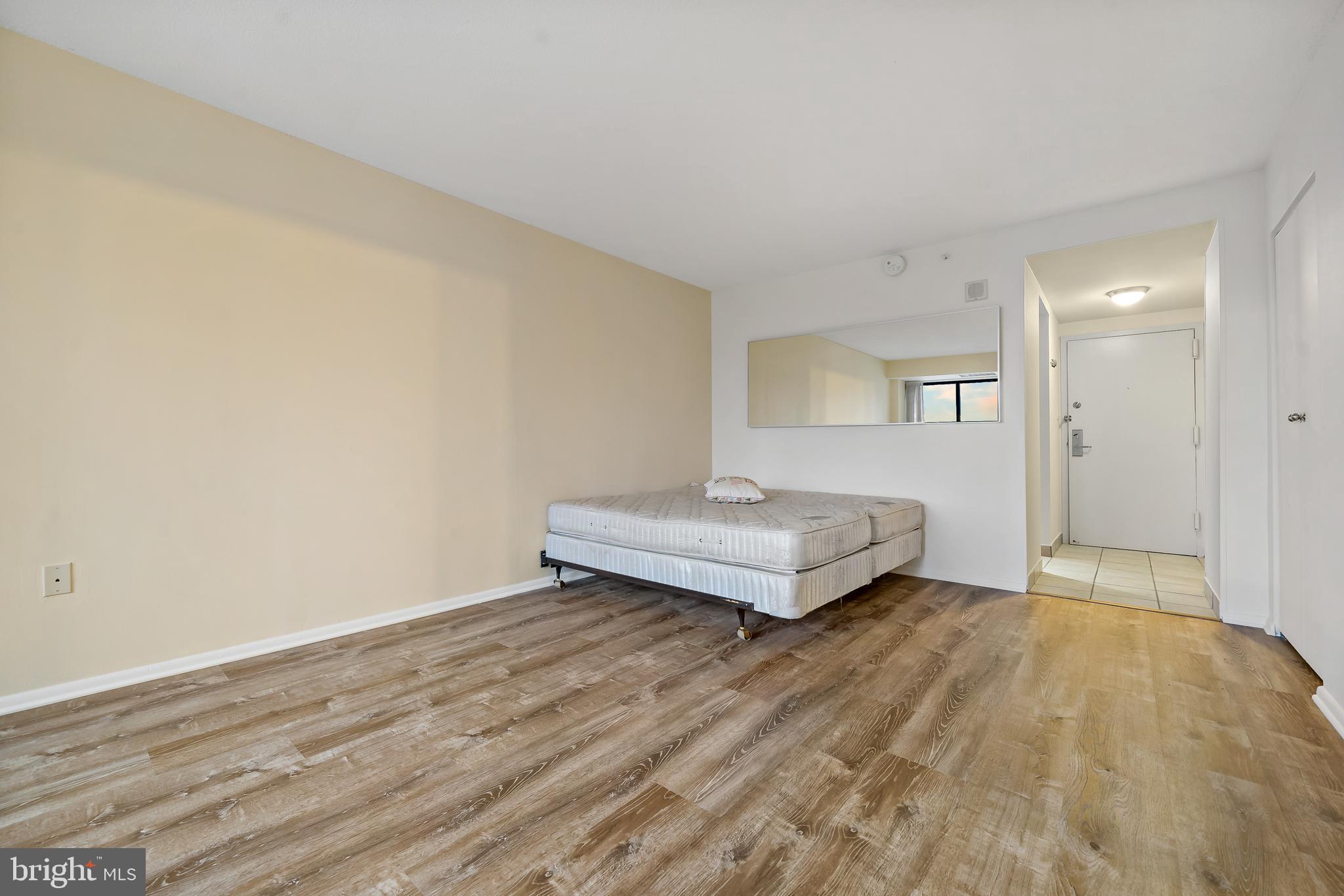 2001 Hamilton Street, Unit 2016 Philadelphia, PA 19130 - Photo 4 of 41 a view of a room with wooden floor and glass door