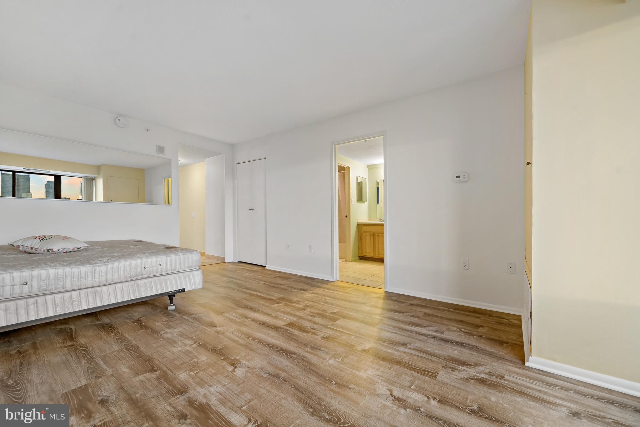 2001 Hamilton Street, Unit 2016 Philadelphia, PA 19130 - Photo 6 of 41 a spacious bedroom with a bed and a table