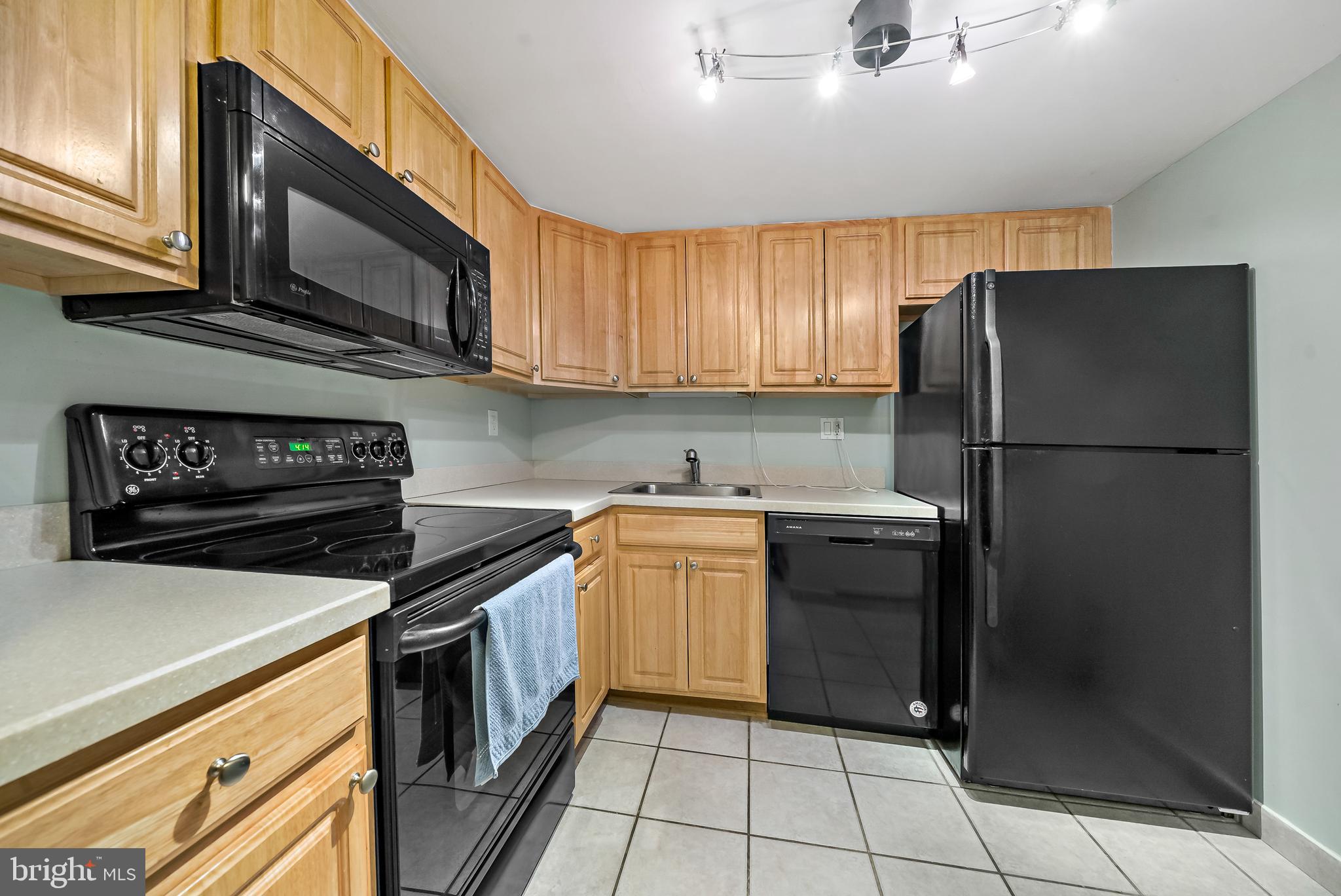 2001 Hamilton Street, Unit 2016 Philadelphia, PA 19130 - Photo 9 of 41 a kitchen with a refrigerator sink and cabinets