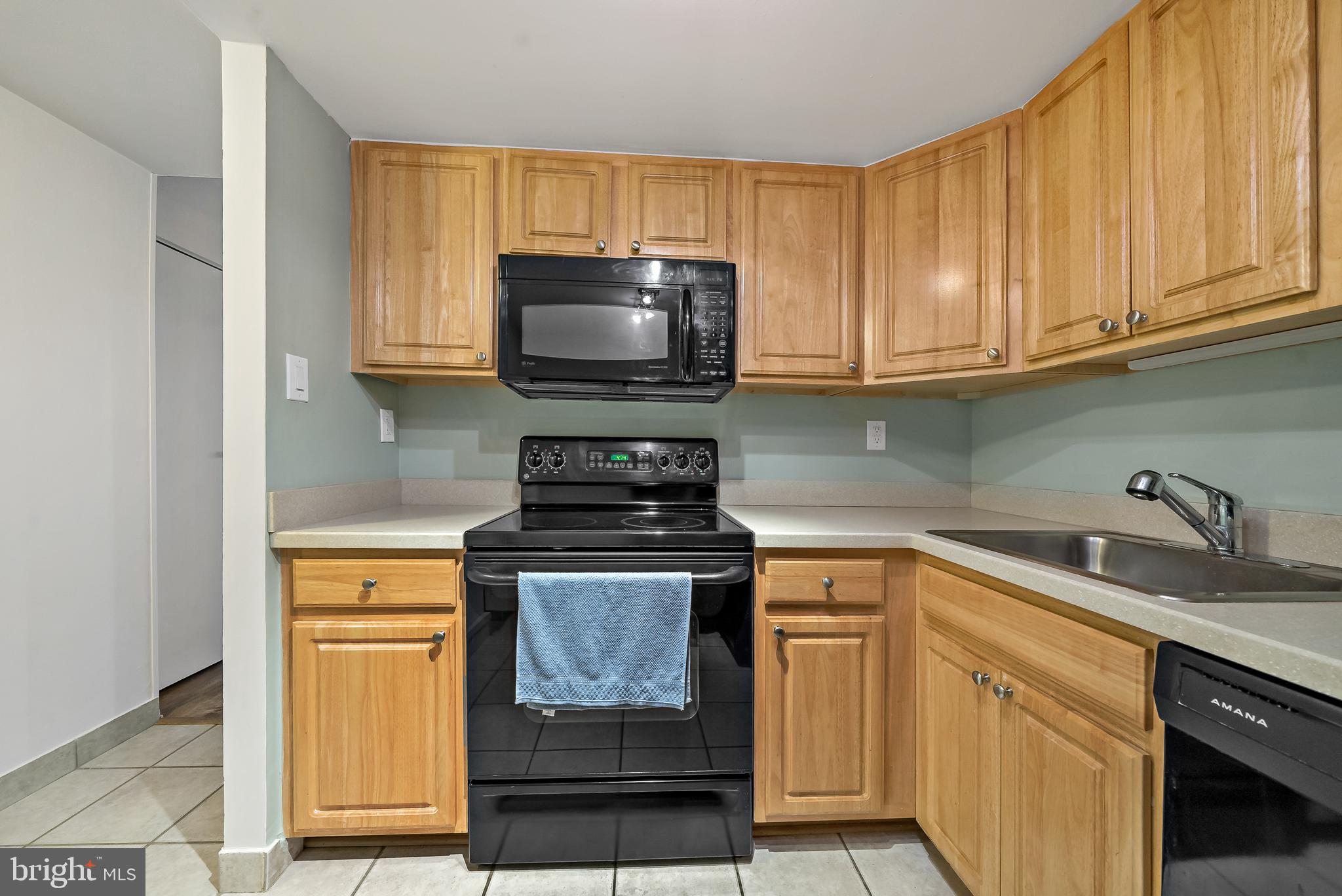 2001 Hamilton Street, Unit 2016 Philadelphia, PA 19130 - Photo 10 of 41 a kitchen with appliances a sink and cabinets
