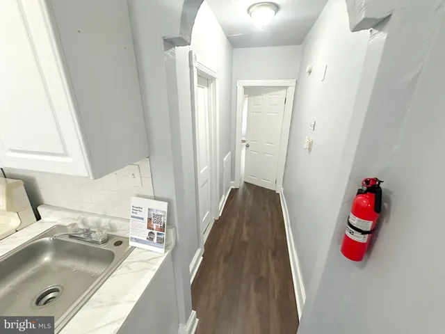 a kitchen with a sink and a stove