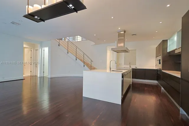 a bathroom with a sink mirror vanity and toilet