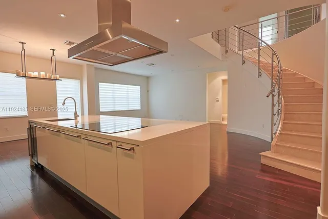 a bathroom with a granite countertop sink a toilet and bathtub