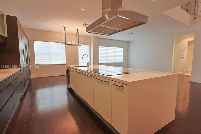 a spacious bathroom with a tub sink and mirror