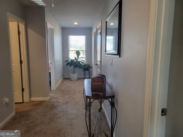 a kitchen with stainless steel appliances kitchen island granite countertop a refrigerator and a stove top oven