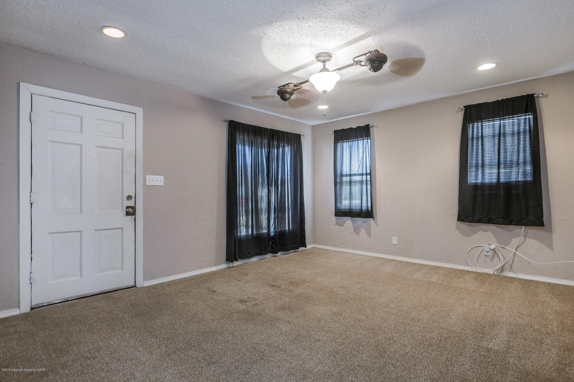 4215 South Harrison Street Amarillo, TX 79110 - Photo 2 of 15 a view of an empty room with a window