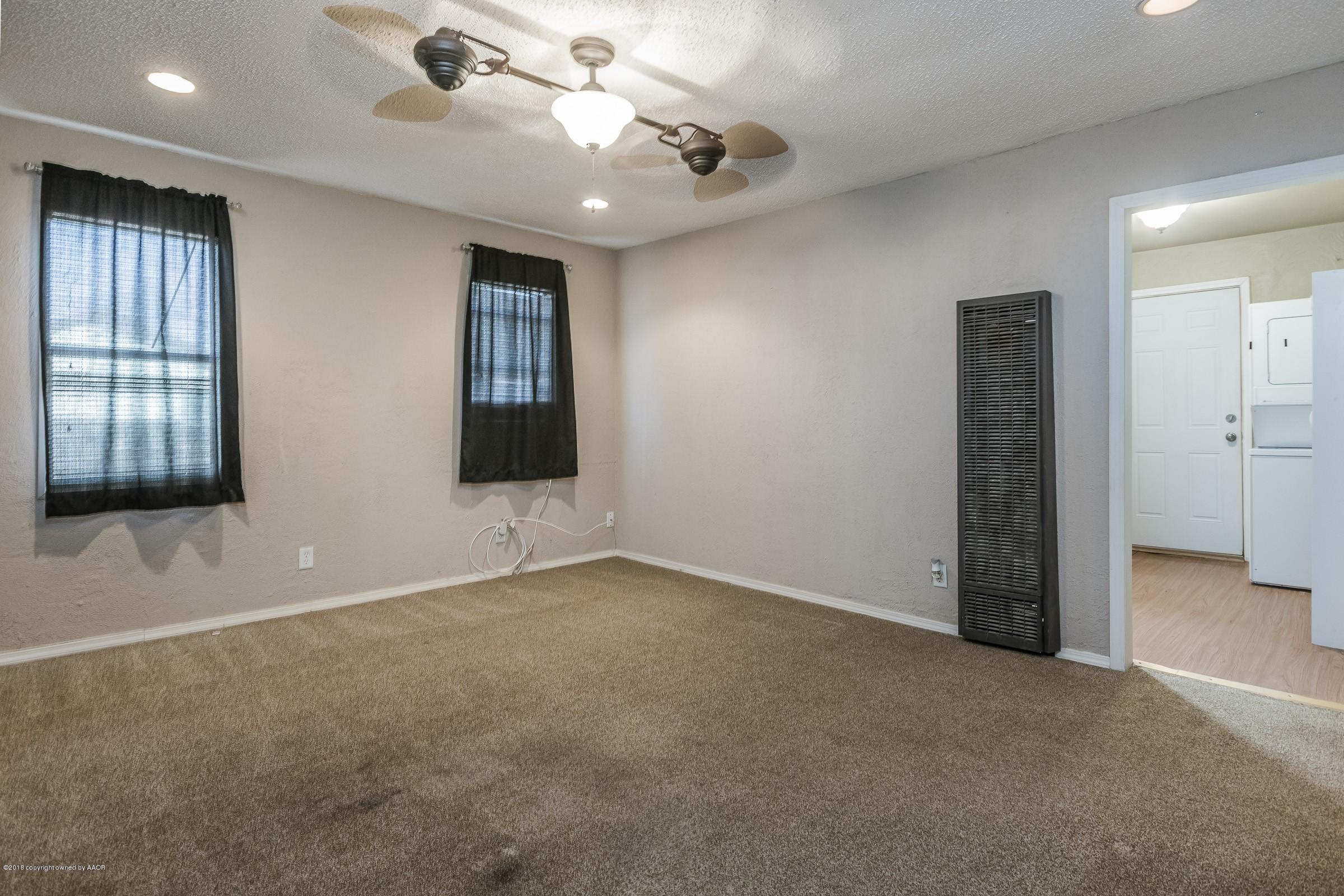 4215 South Harrison Street Amarillo, TX 79110 - Photo 6 of 15 an empty room with windows and closet