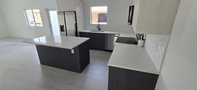 a bathroom with a sink a mirror and a bathtub