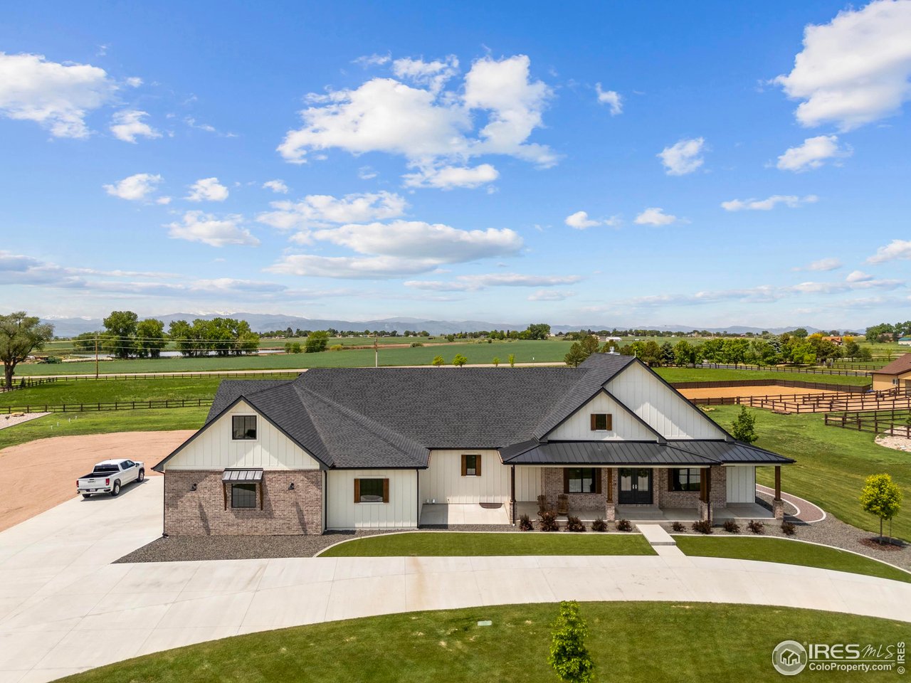 a front view of house with a garden and swimming pool