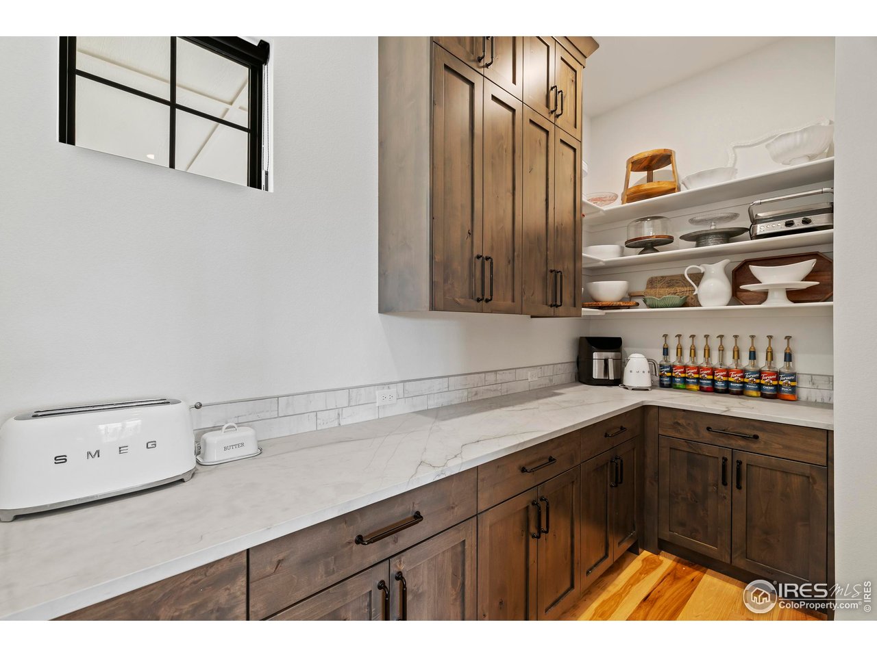 37179 Soaring Eagle Circle Severance, CO 80550 - Photo 12 of 40 a kitchen with a sink and cabinets