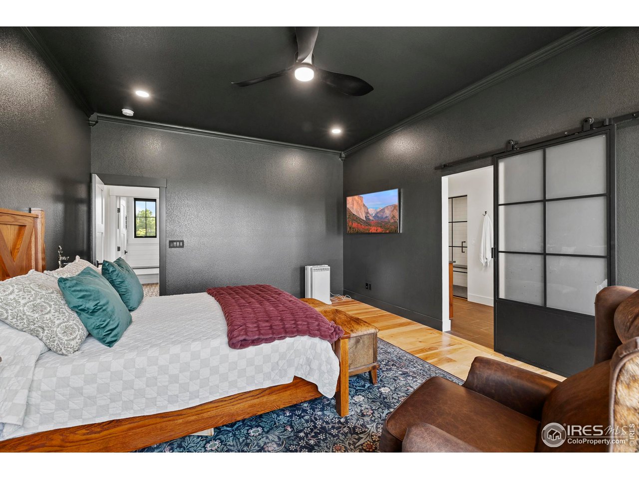 37179 Soaring Eagle Circle Severance, CO 80550 - Photo 17 of 40 a bedroom with a bed window and couch