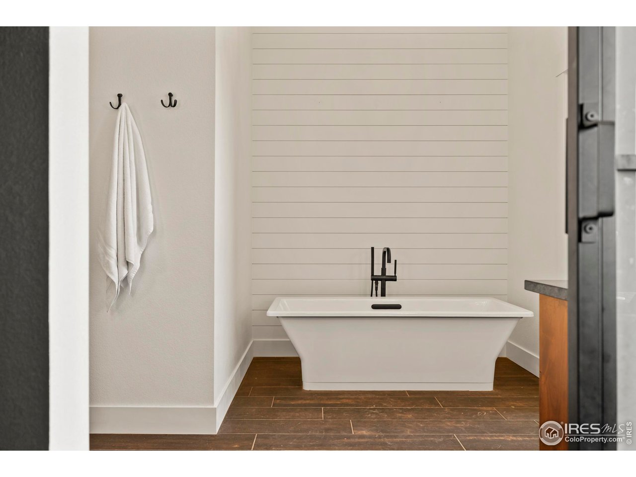 37179 Soaring Eagle Circle Severance, CO 80550 - Photo 18 of 40 a bathroom with a bathtub