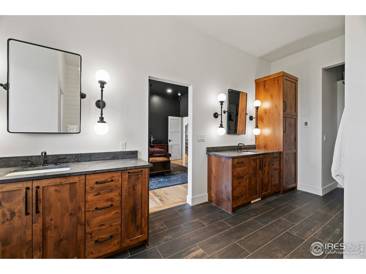 37179 Soaring Eagle Circle Severance, CO 80550 - Photo 19 of 40 a bathroom with a sink double vanity and a mirror