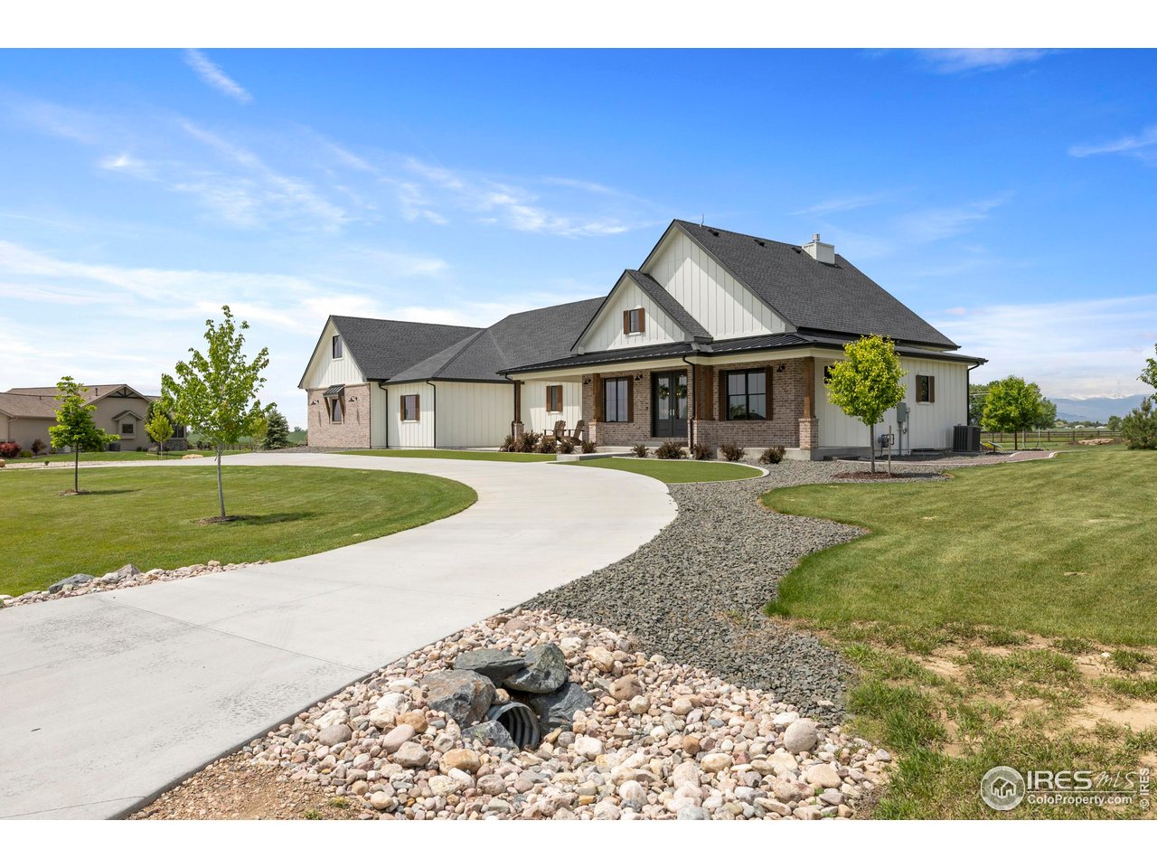 37179 Soaring Eagle Circle Severance, CO 80550 - Photo 2 of 40 a front view of a house with a yard