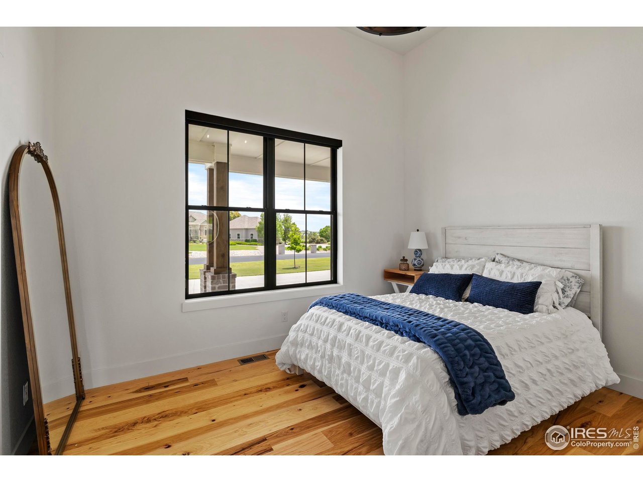 37179 Soaring Eagle Circle Severance, CO 80550 - Photo 23 of 40 a bedroom with a bed next to a window