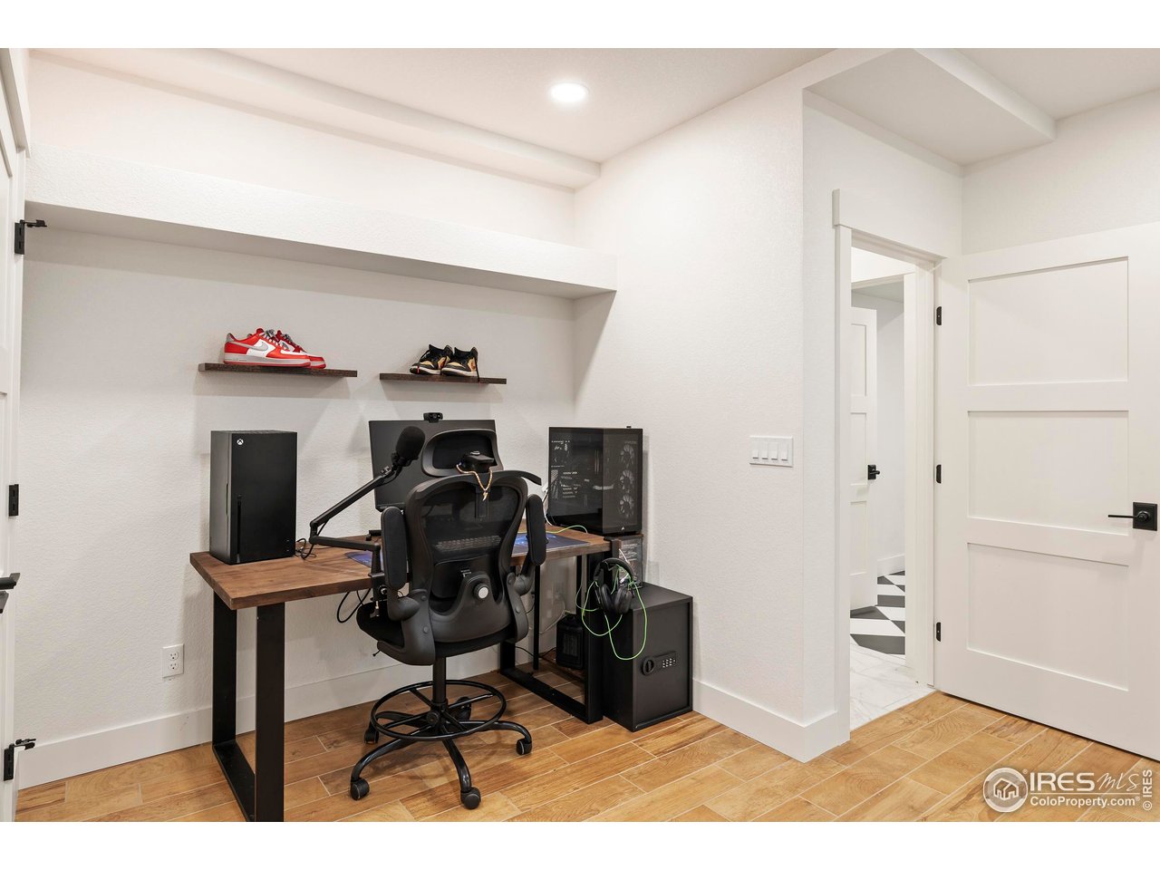 37179 Soaring Eagle Circle Severance, CO 80550 - Photo 33 of 40 a view of a workspace with furniture and a livingroom