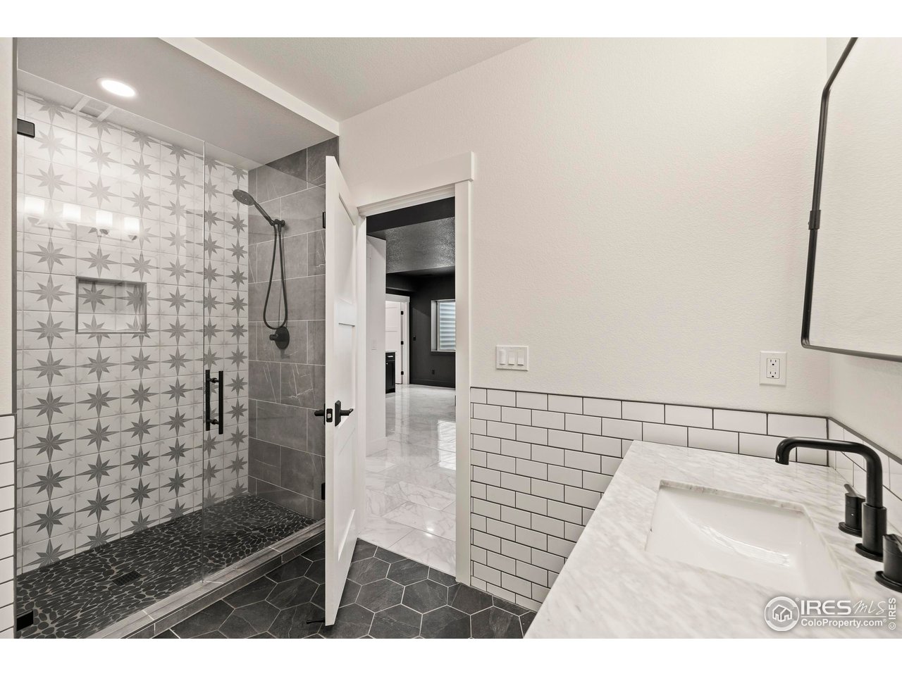 37179 Soaring Eagle Circle Severance, CO 80550 - Photo 35 of 40 a bathroom with a sink a toilet and shower