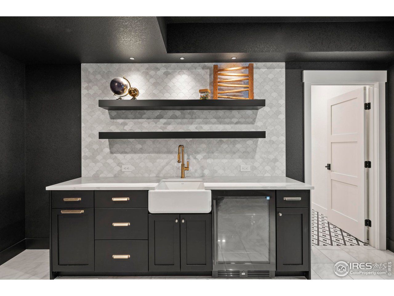 37179 Soaring Eagle Circle Severance, CO 80550 - Photo 37 of 40 a kitchen with a sink and cabinets