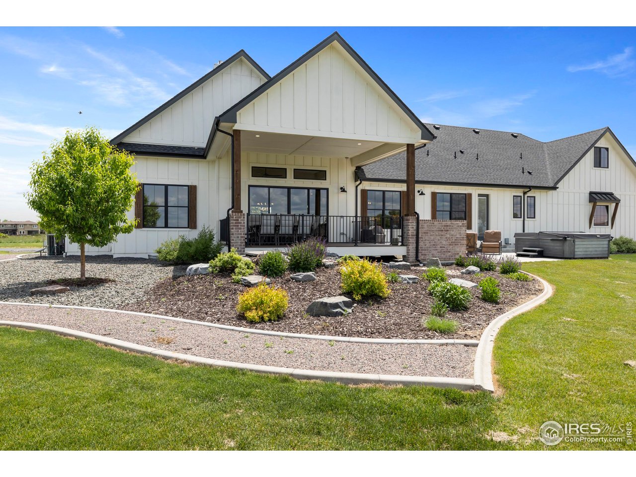37179 Soaring Eagle Circle Severance, CO 80550 - Photo 39 of 40 a view of a house with swimming pool and a yard