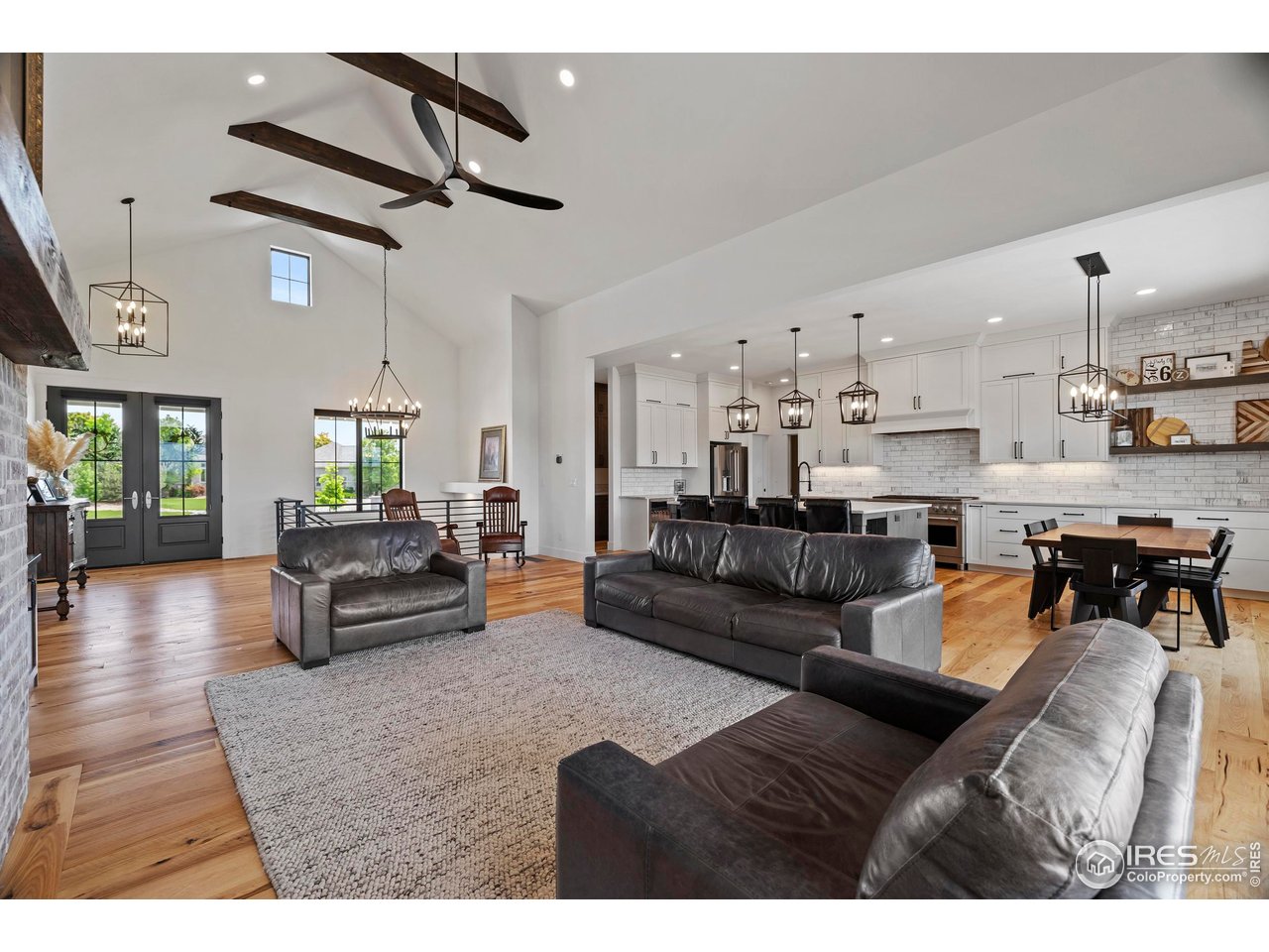 37179 Soaring Eagle Circle Severance, CO 80550 - Photo 7 of 40 a living room with furniture and kitchen view