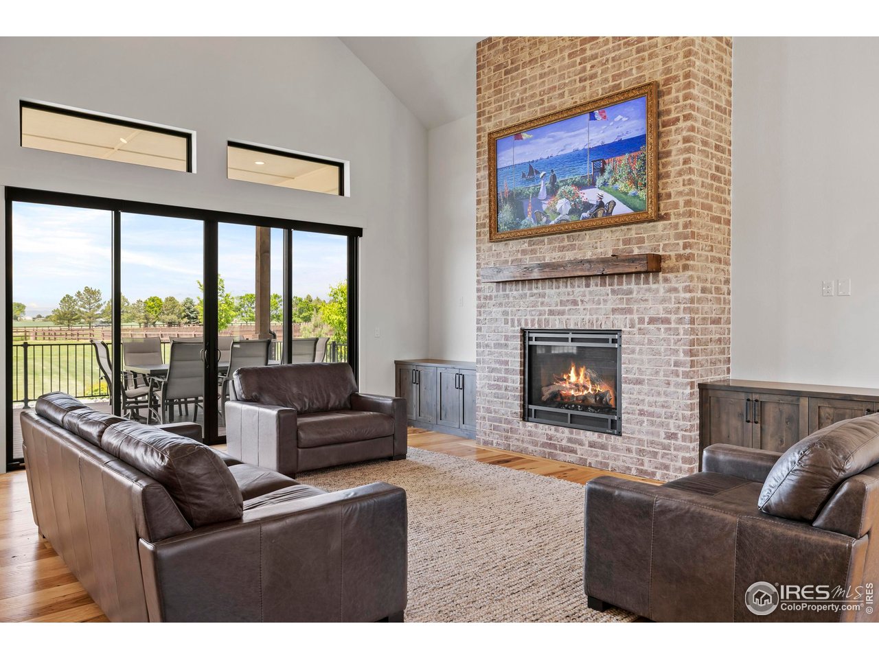 37179 Soaring Eagle Circle Severance, CO 80550 - Photo 8 of 40 a living room with furniture a large window and a fireplace