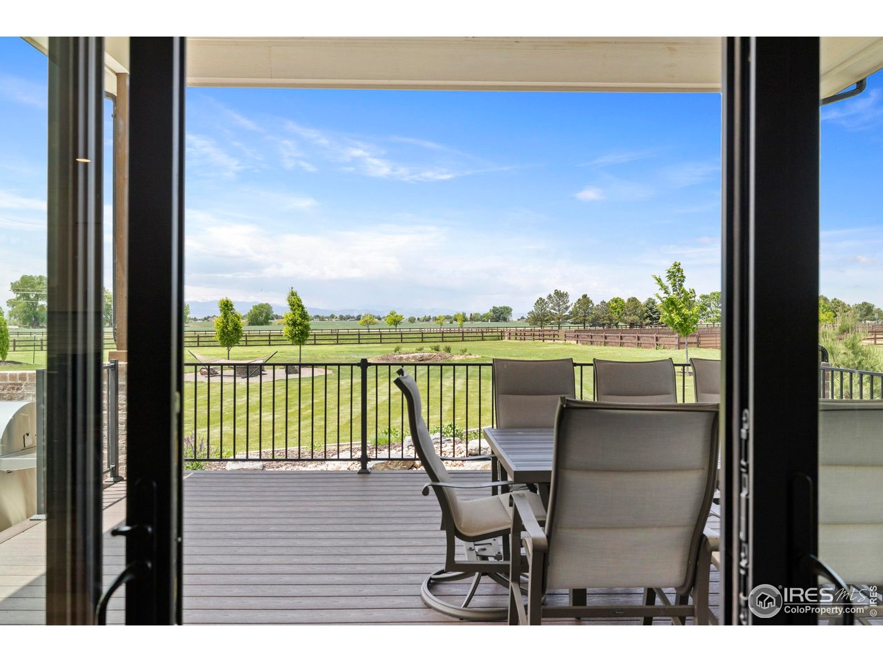 37179 Soaring Eagle Circle Severance, CO 80550 - Photo 9 of 40 a view of a balcony with a table and chairs
