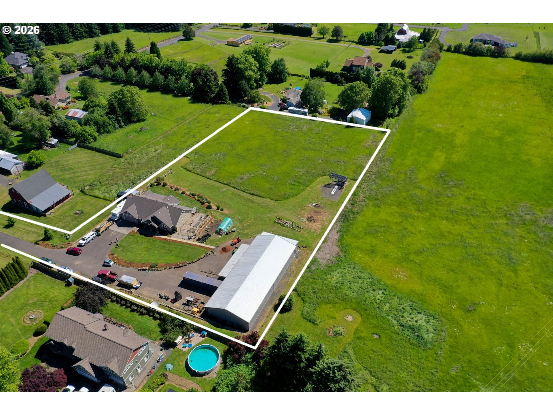 33058 Church Road Warren, OR 97053 - Photo 42 of 45 an aerial view of a tennis ground and a cars park side of the road