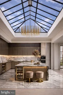 a room with granite countertop kitchen island stainless steel appliances and living room