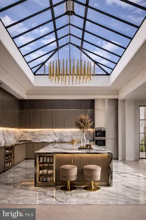 a room with granite countertop kitchen island stainless steel appliances and living room