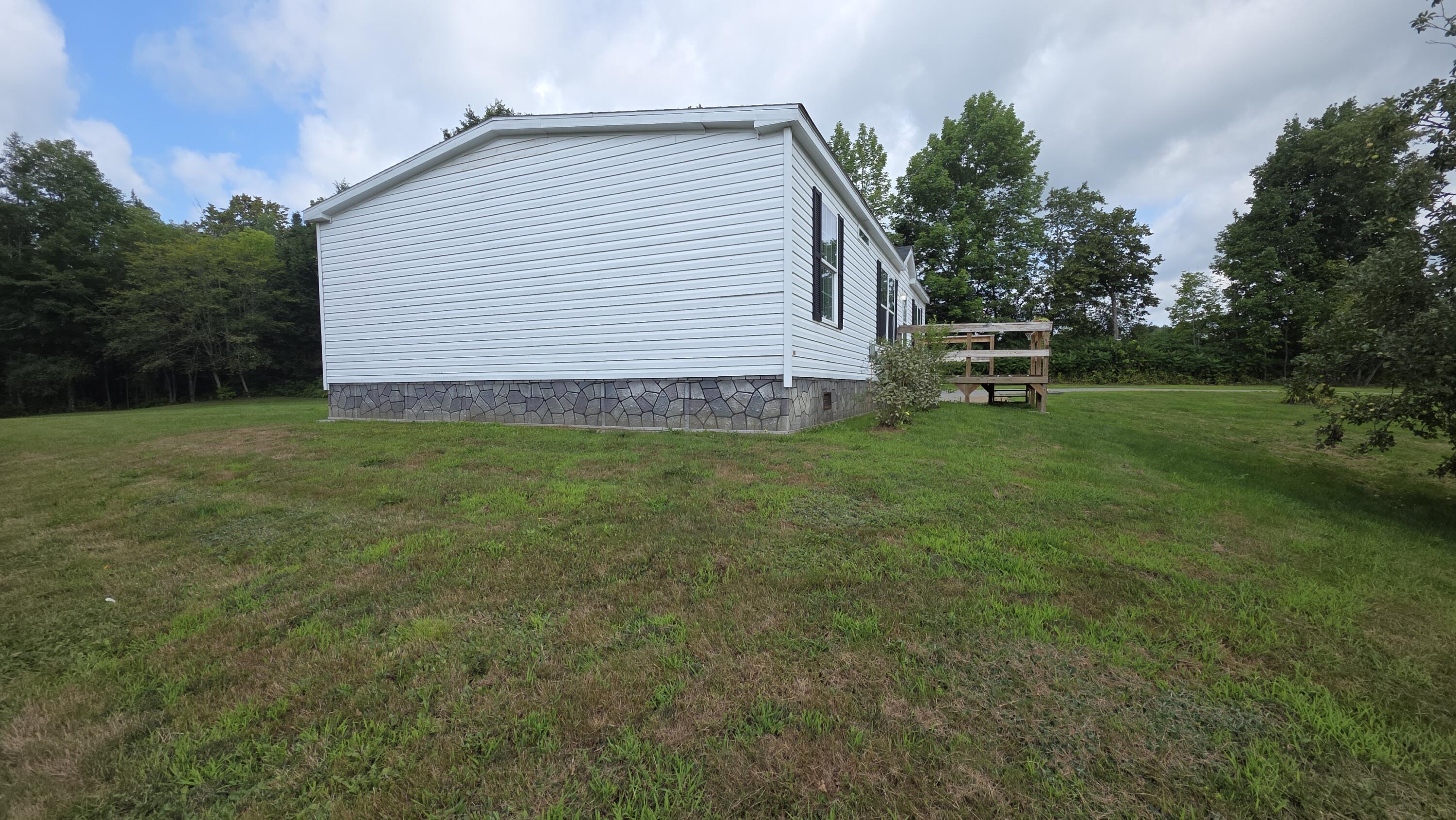 32 Beans Corner Road Pittsfield, ME 04967 - Photo 6 of 51 Closer View of Left Side Home