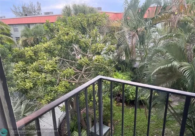 a view of a balcony with a pot