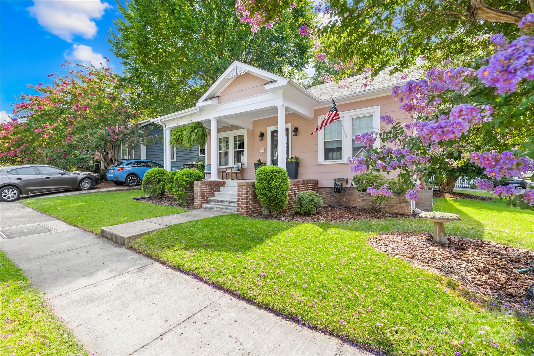 2135 Scott Avenue Charlotte, NC 28203 - Photo 12 of 48 a view of a house with a yard and potted plants