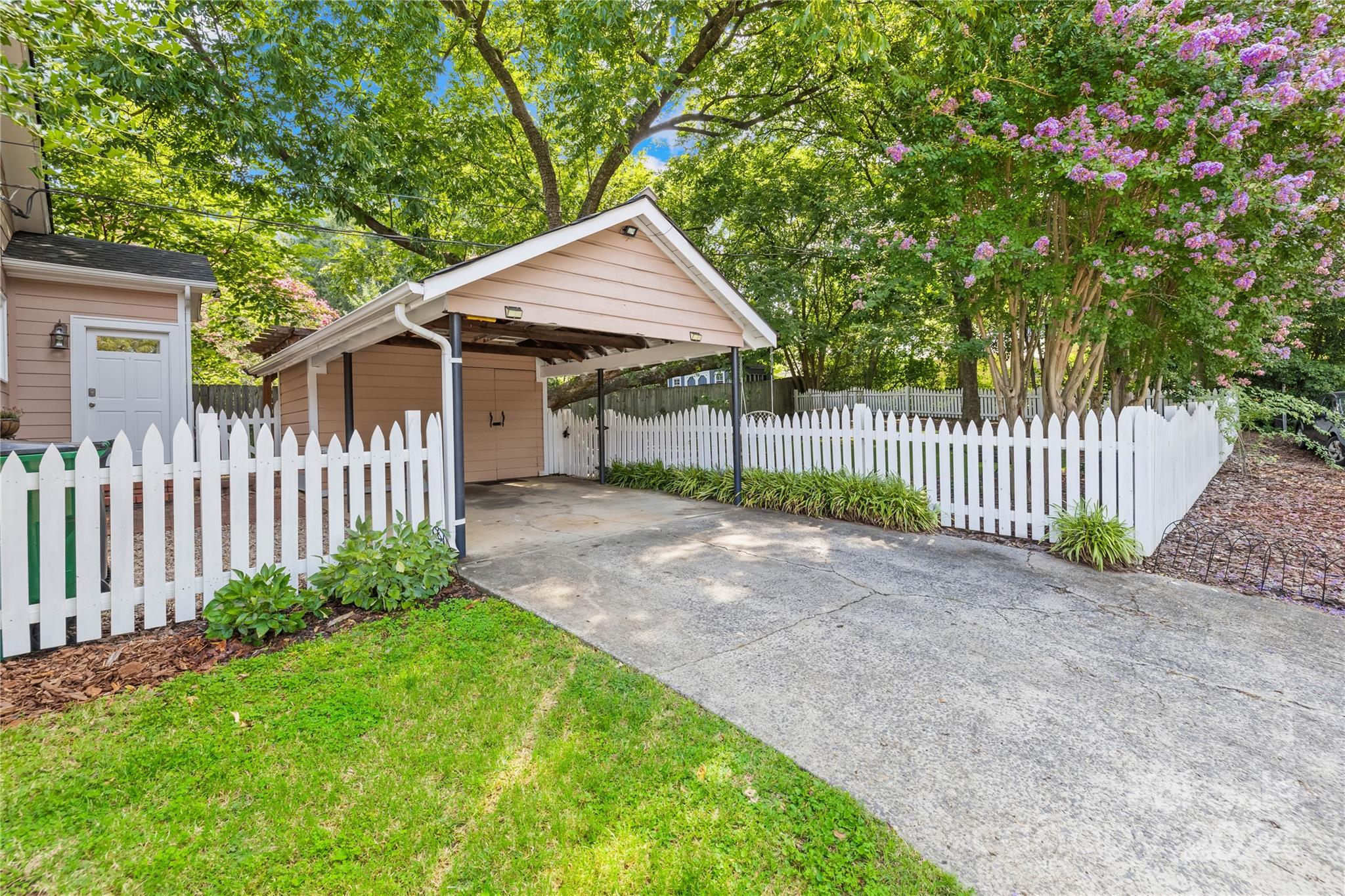 2135 Scott Avenue Charlotte, NC 28203 - Photo 14 of 48 a view of a small yard with wooden fence and trees