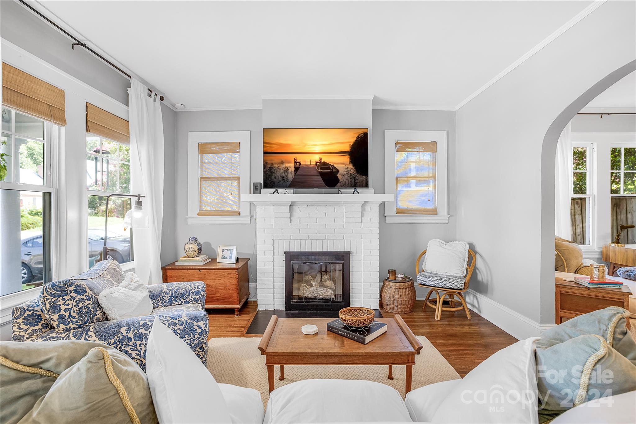 2135 Scott Avenue Charlotte, NC 28203 - Photo 17 of 48 a living room with furniture a fireplace and a flat screen tv