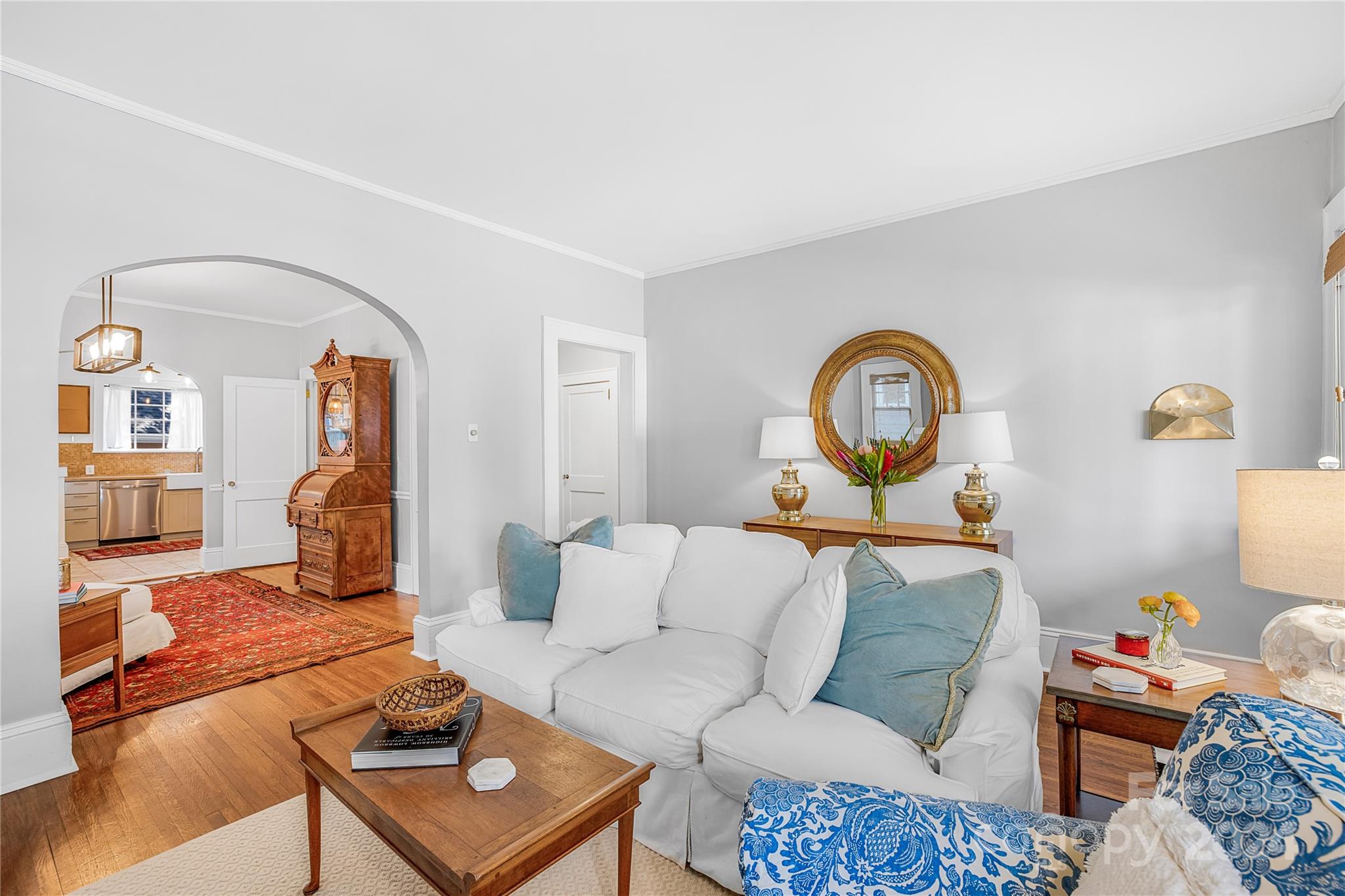 2135 Scott Avenue Charlotte, NC 28203 - Photo 19 of 48 a living room with furniture a rug and a lamp