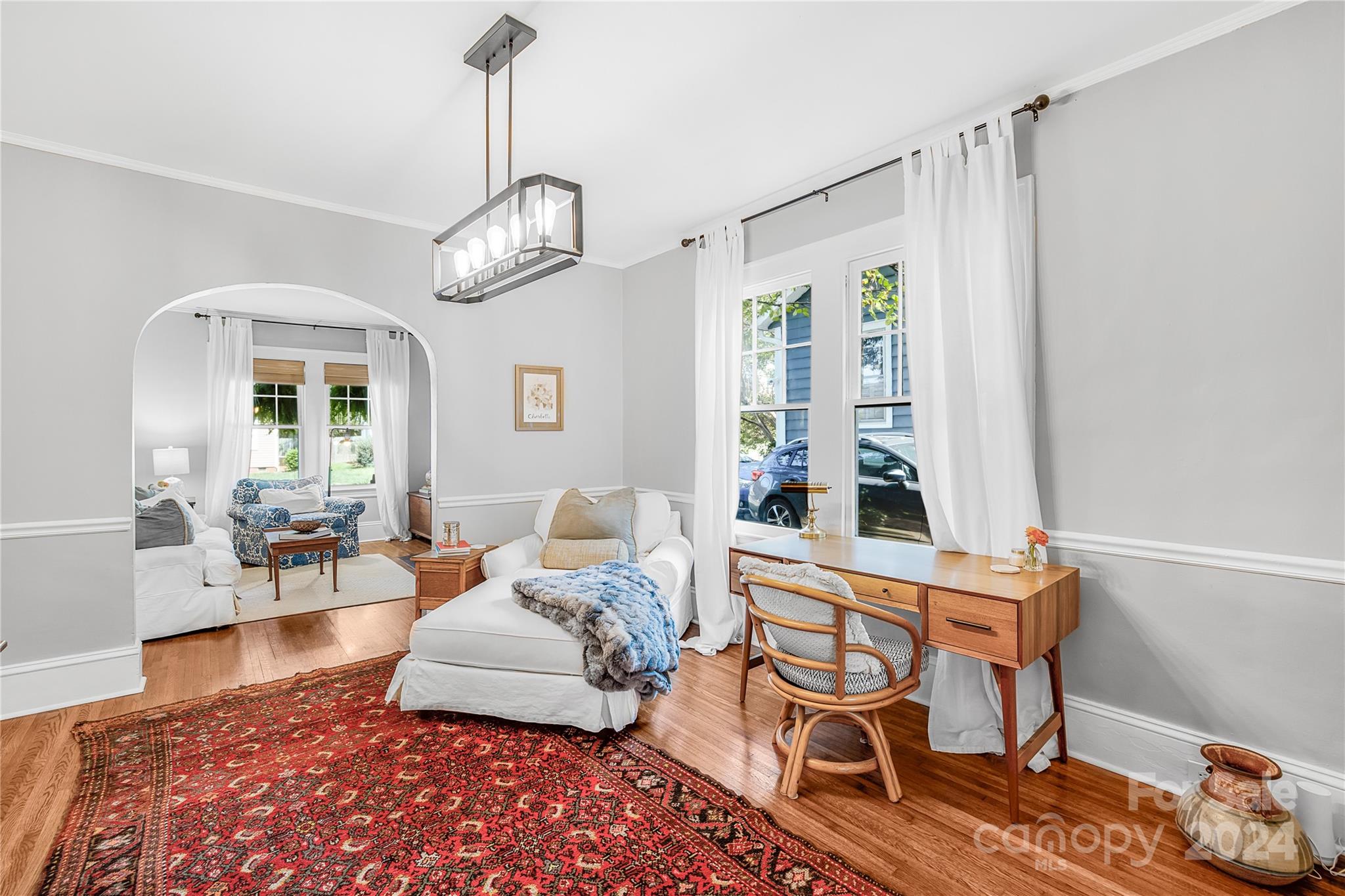 2135 Scott Avenue Charlotte, NC 28203 - Photo 21 of 48 a living room with furniture and a chandelier