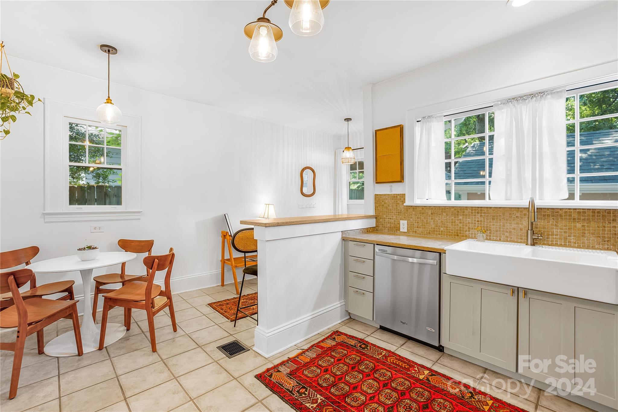 2135 Scott Avenue Charlotte, NC 28203 - Photo 25 of 48 a kitchen that has a sink and a stove