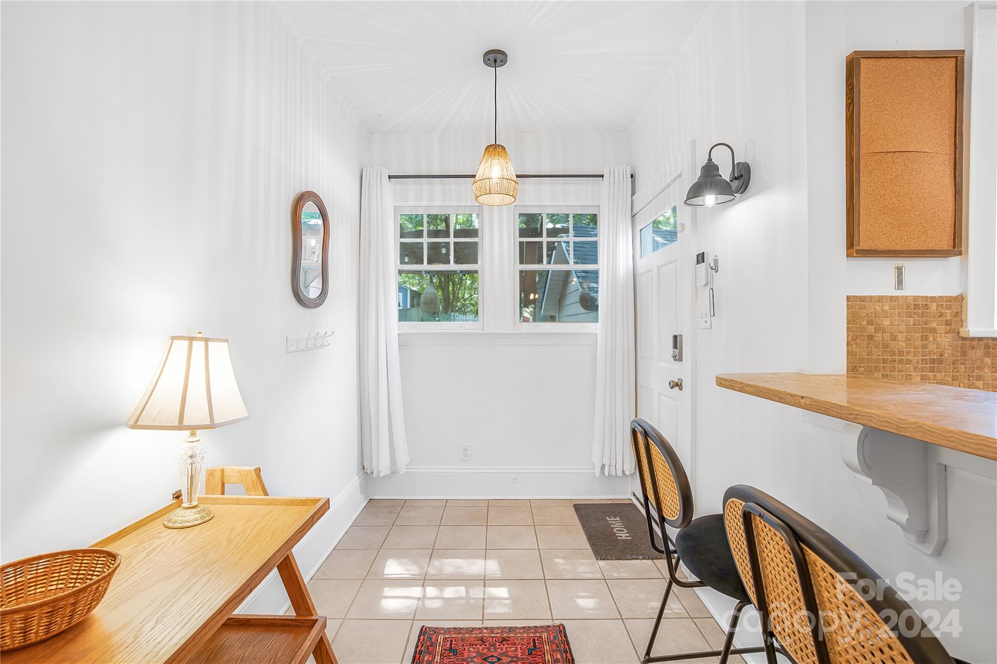 2135 Scott Avenue Charlotte, NC 28203 - Photo 27 of 48 a very nice looking room with a big bed and a window