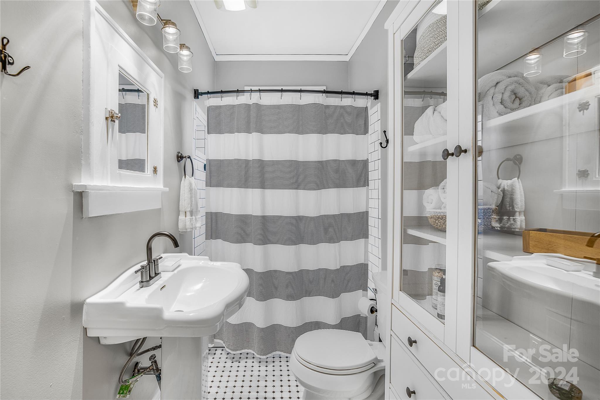 2135 Scott Avenue Charlotte, NC 28203 - Photo 31 of 48 a bathroom with a sink toilet and shower