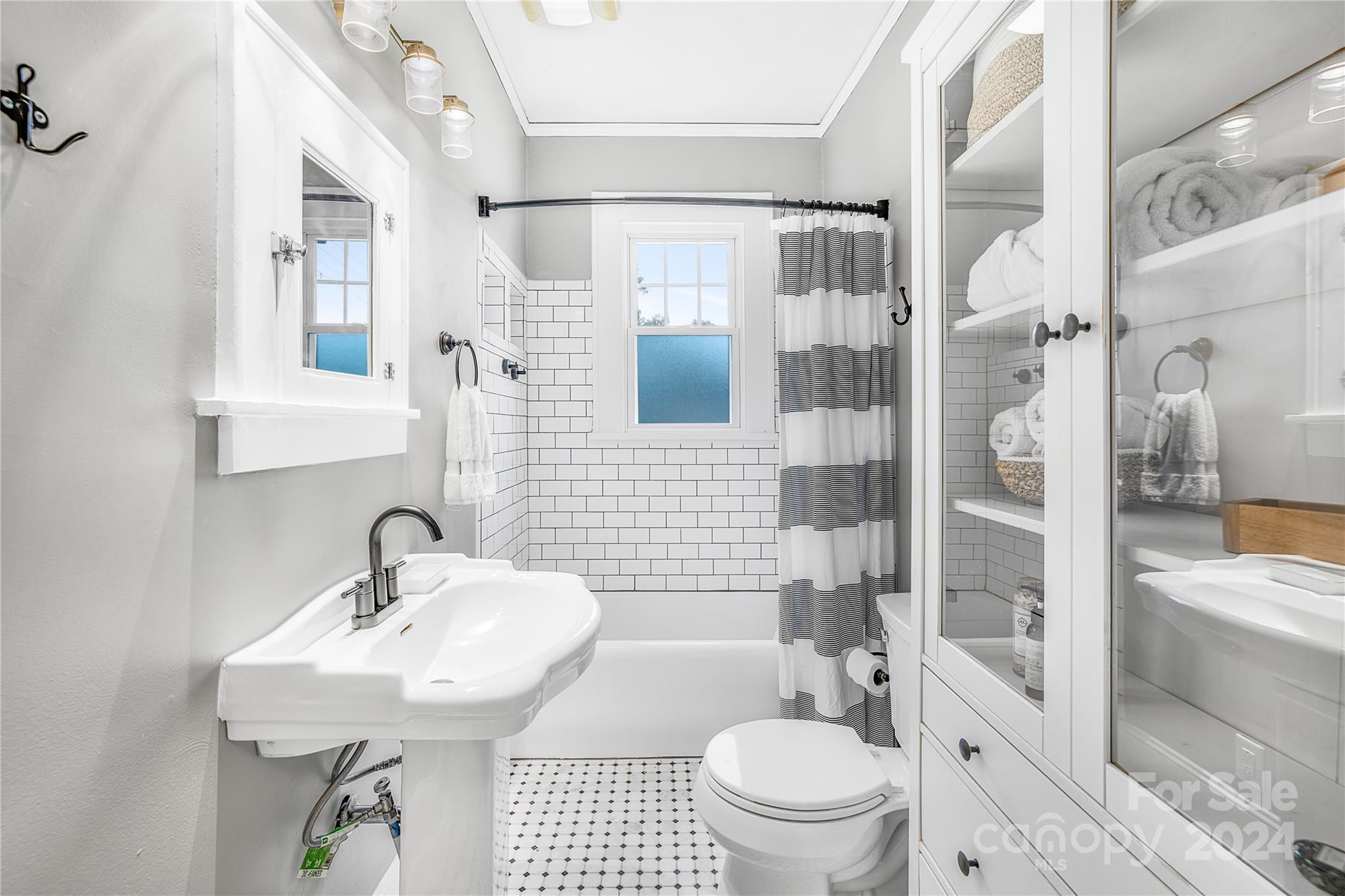 2135 Scott Avenue Charlotte, NC 28203 - Photo 34 of 48 a bathroom with a sink toilet and shower