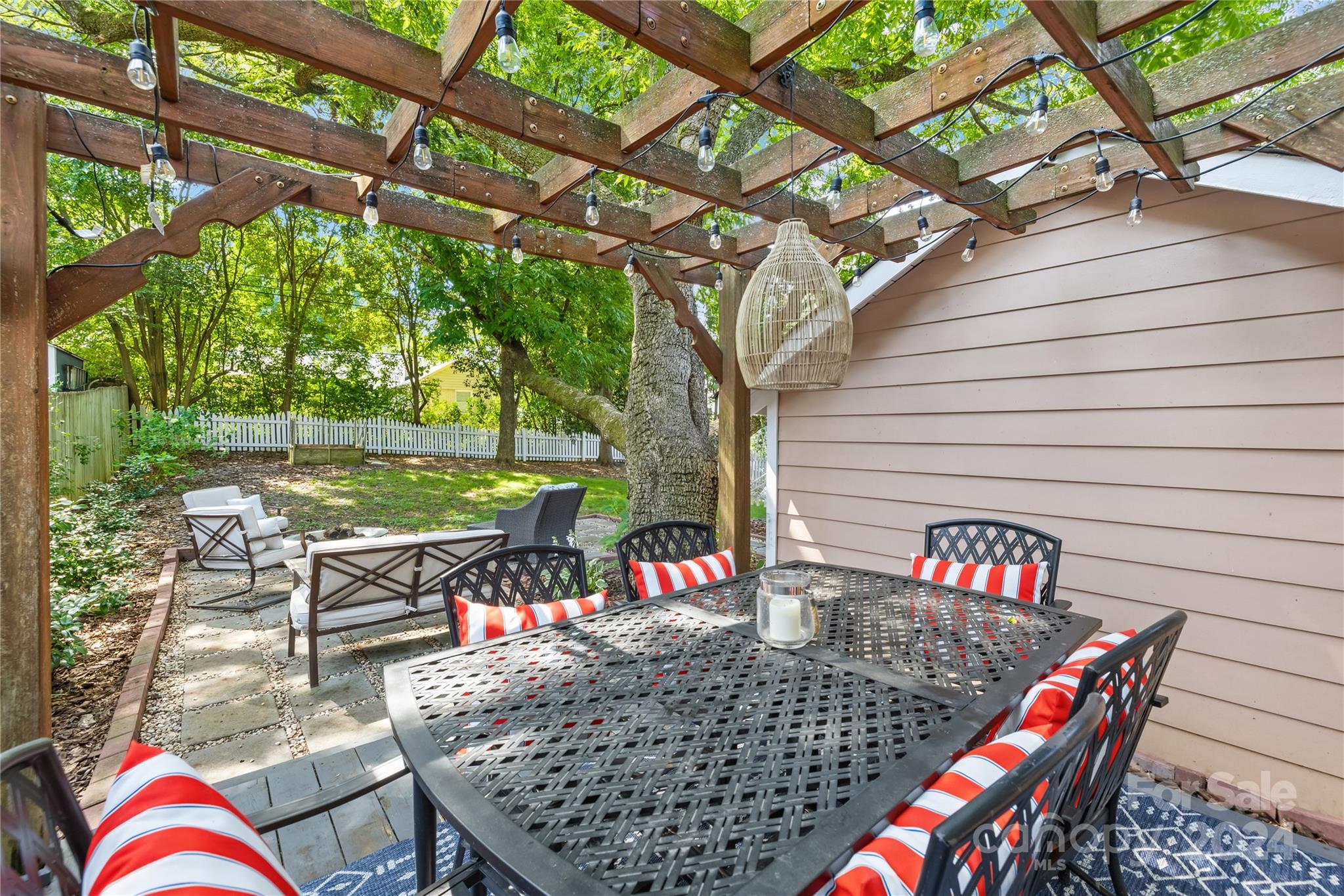 2135 Scott Avenue Charlotte, NC 28203 - Photo 40 of 48 an outdoor sitting area with couch and outdoor seating