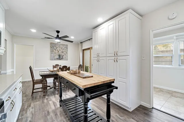 a view of a dining room with furniture and window